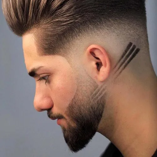 Slicked back haircut with artistic low fade beard