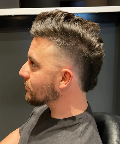 Euro Hawk with voluminous top and faded sides for a clean European-inspired finish.