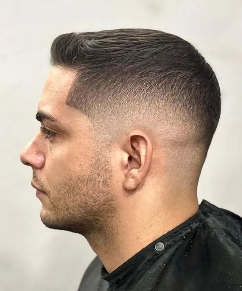 Buzzed Faux Hawk with subtle crown lift and tight sides for bold, minimal styling.