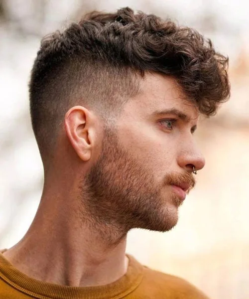 Curly Faux Hawk with lifted tight curls and clean skin taper for bold natural definition.