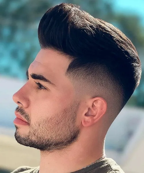 Faux Hawk pompadour with lifted front and clean sides for bold volume and polish.