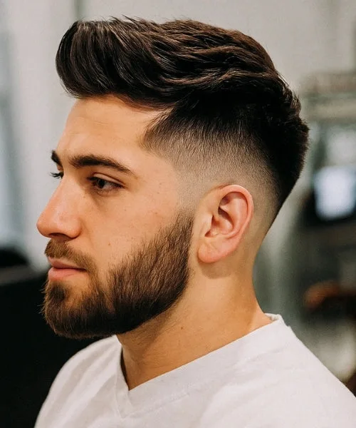 Faux Hawk with spiked crown and shaped beard for balanced, bold masculine profile.