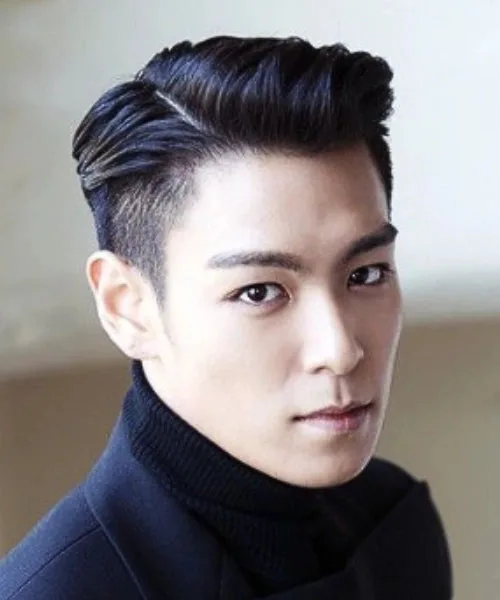 Korean side part hairstyle with sharp fade, voluminous parted top, and polished flow.