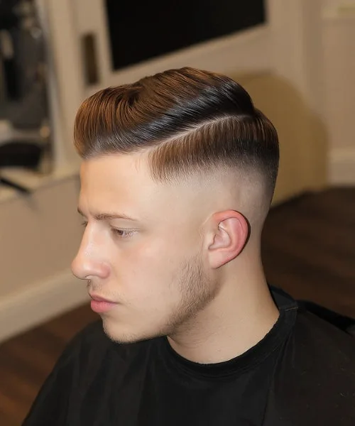 Skin fade side part haircut with defined part and smooth top styled for structure and movement.