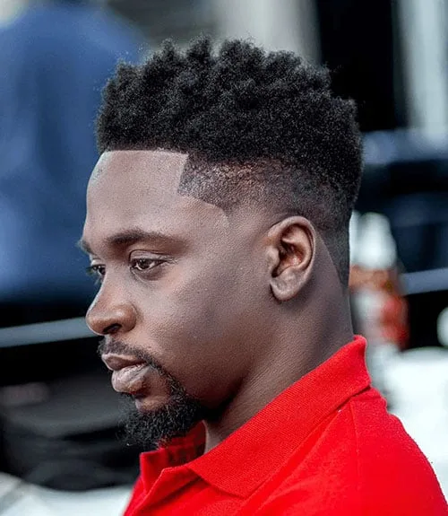 Thick Afro-Textured Top with Short Faded Sides