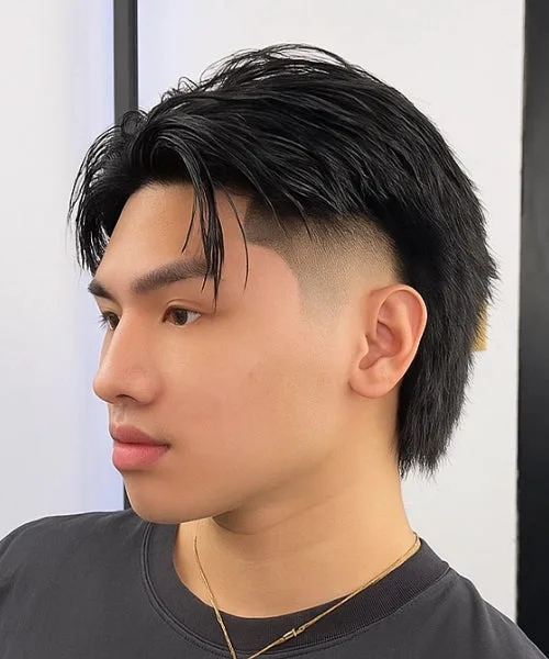 Burst fade middle part with curved fade and parted crown flow