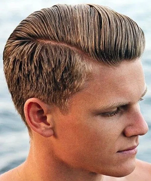 Scissor cut comb over with precise sides and voluminous brushed top for a clean, stylish finish