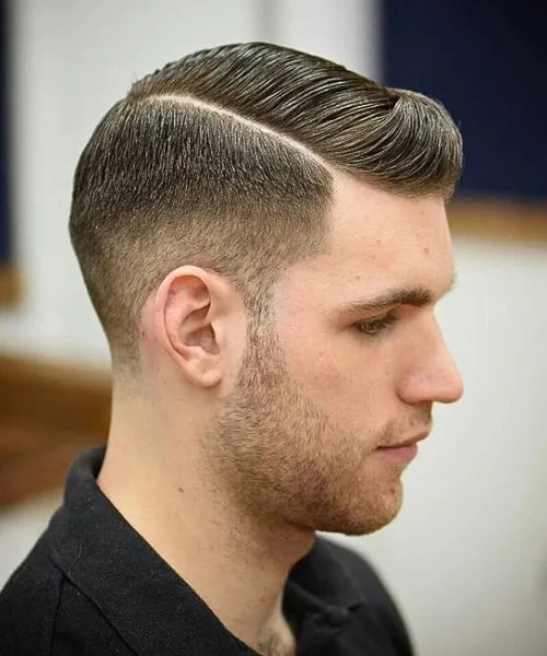 Side part comb over haircut with structured top and clean faded sides for a sharp polished look