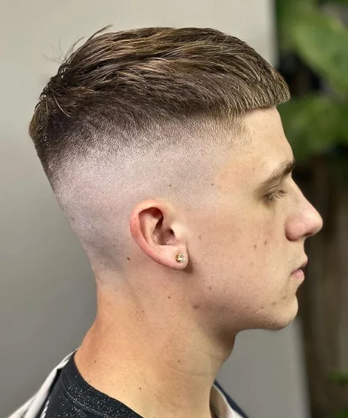 French crop skin fade haircut with blunt fringe and sharp faded sides for modern polish