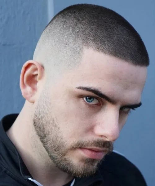 Skin fade buzz cut with short cropped top and clean skin-faded sides for minimal style