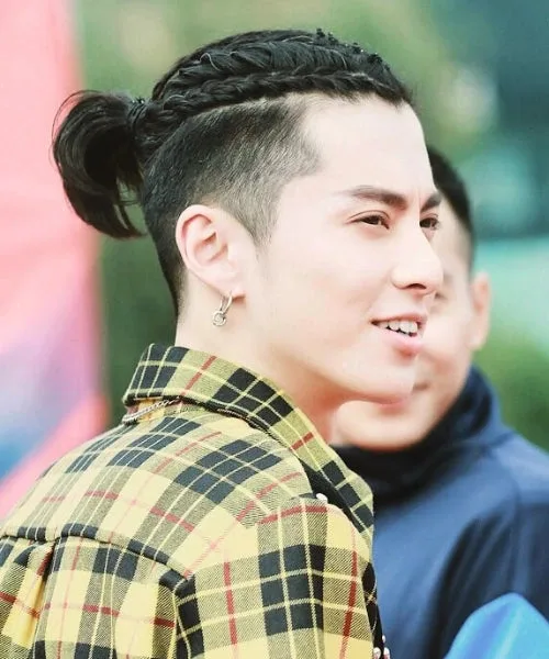 Temp fade with braids featuring sharp faded temples and tight defined braided tops.