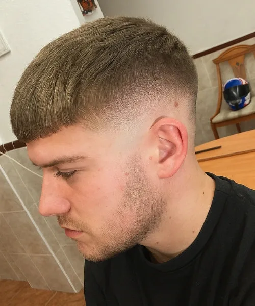 Blonde Caesar cut with blunt fringe, faded sides, and smooth textured top for light hair