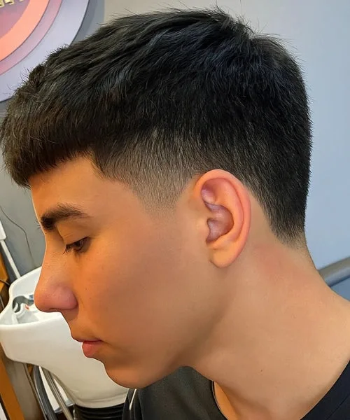 Caesar cut with neck taper, blended sides, and textured fringe for a balanced silhouette