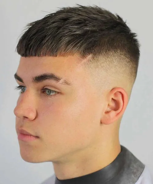 High fade haircut with textured fringe and tight fade sides for street-style edge