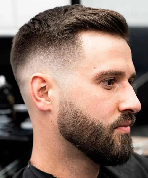 High fade with beard blending sharp skin fade and sculpted facial hair for defined shape