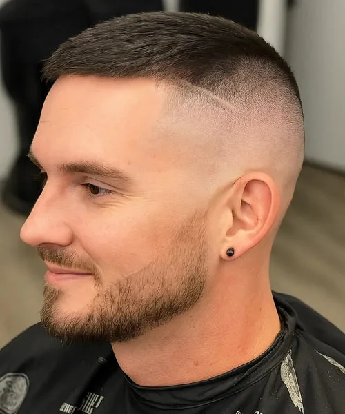 High and tight fade haircut with cropped top and military-style skin fade on sides