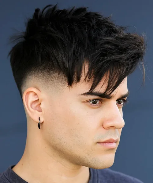 Medium high fade haircut with slightly lower taper and textured messy top for versatility